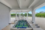 Foosball table located outdoor under cover for some backyard fun